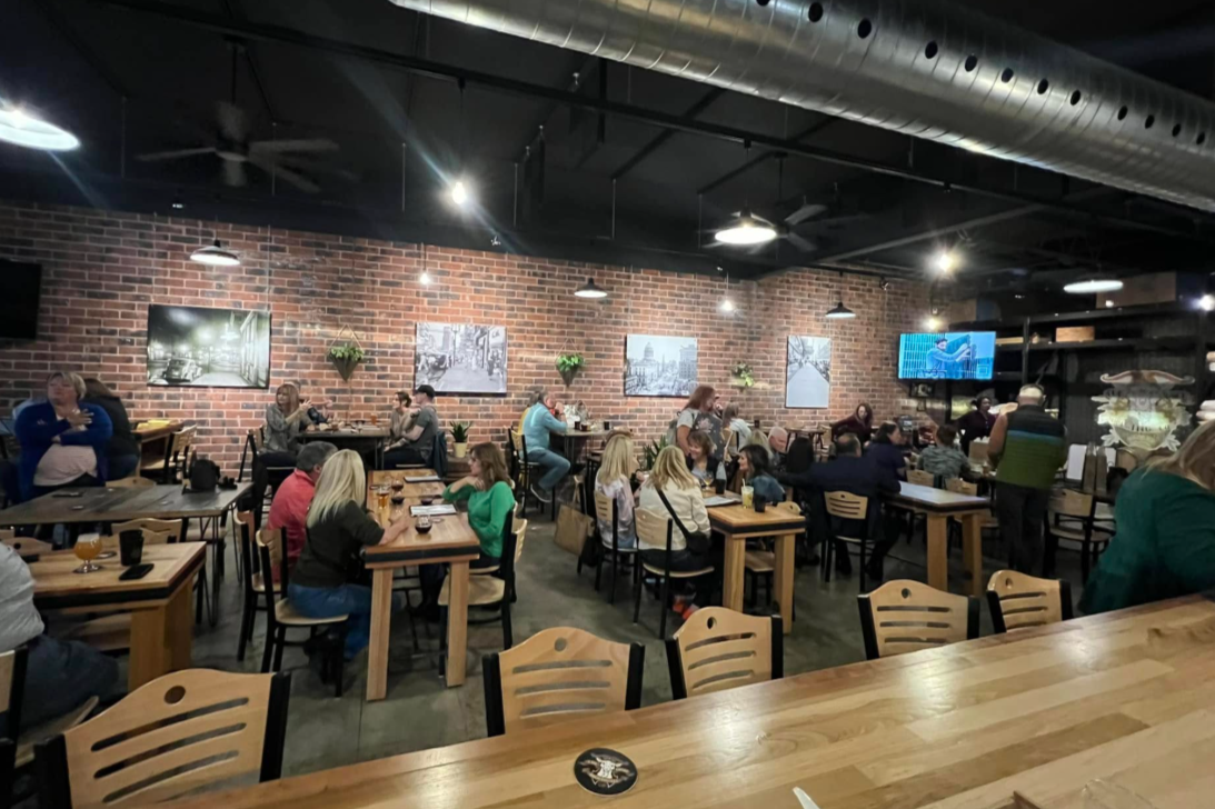 interior of a brewery with people sitting at tables